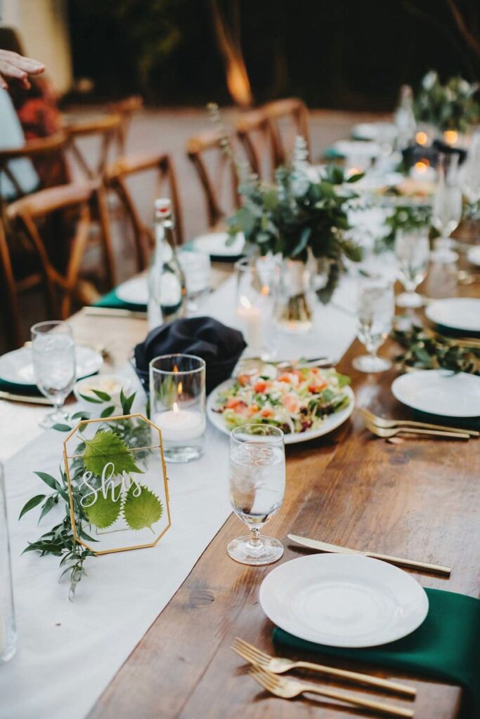 Family Style Meal Table Setting With Greenery