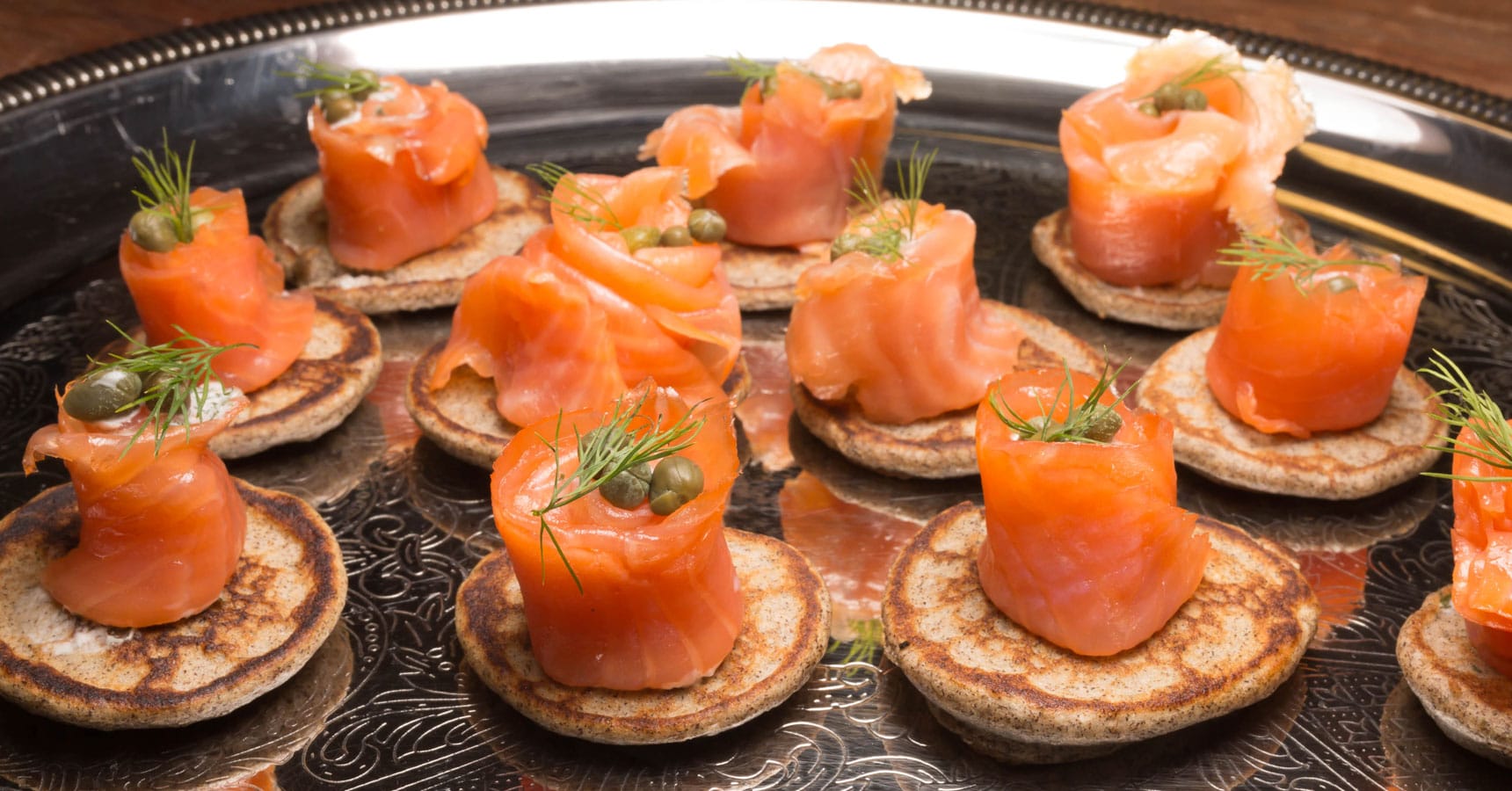 Blini: Russ and Daughters Smoked Salmon, Dill Creme Fraiche, Capers by Crave Catering