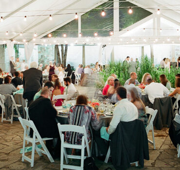 Tented wedding reception at the Wildflower Center by Crave Catering