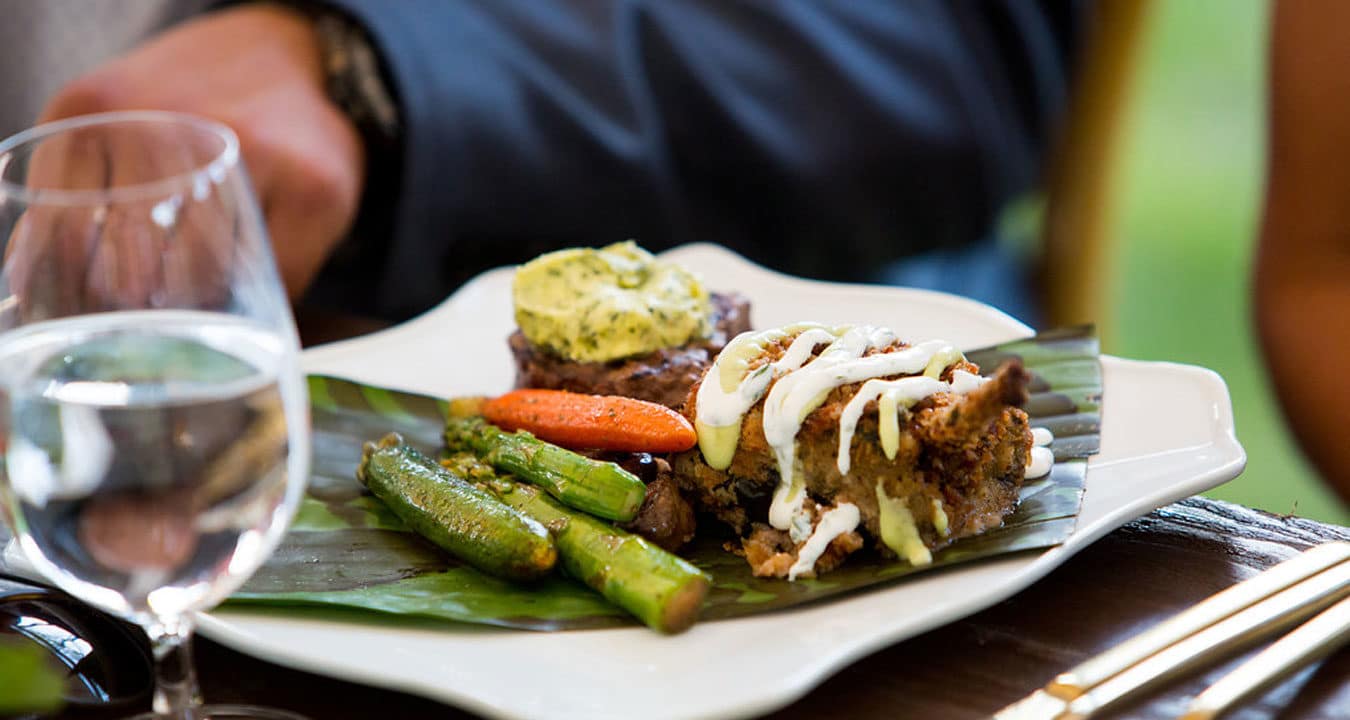 Pecan crusted chicken chile relleno, grilled beef tenderloin and achiote rubbed baby vegetables